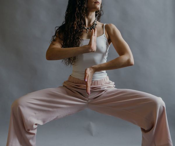 Person in a dynamic yoga pose feeling energized and focused.